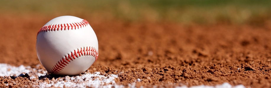 Close up of baseball in dirt