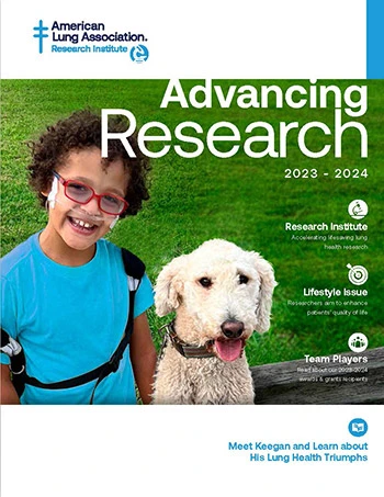 Advancing Research magazine cover with image of child, Keegan, in a blue shirt next to a beige colored dog.
